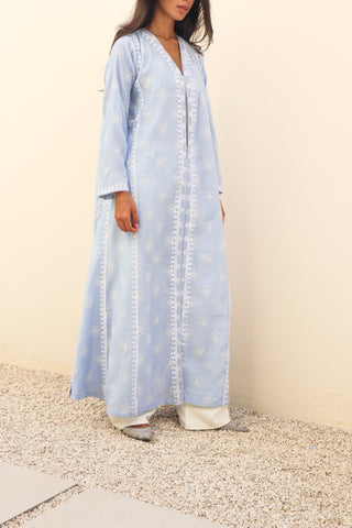The Language Of Flowers S.FO1-an elegant powder blue abaya featuring delicate floral cutwork fabric and intricate white embroidery.