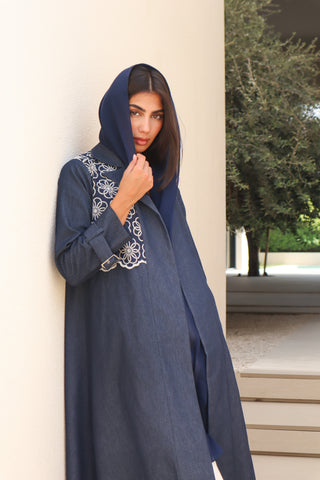 Shimmer-The Art of Layers S.LO2 - a luxurious denim abaya featuring beautifully embroidered floral panels that add depth and elegance to the design. 