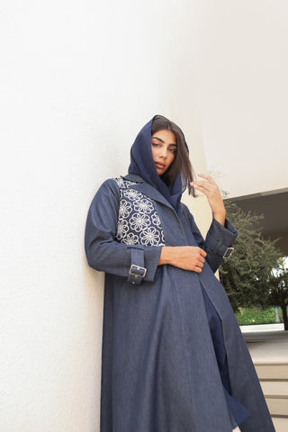 Shimmer-The Art of Layers S.LO2 - a luxurious denim abaya featuring beautifully embroidered floral panels that add depth and elegance to the design. 