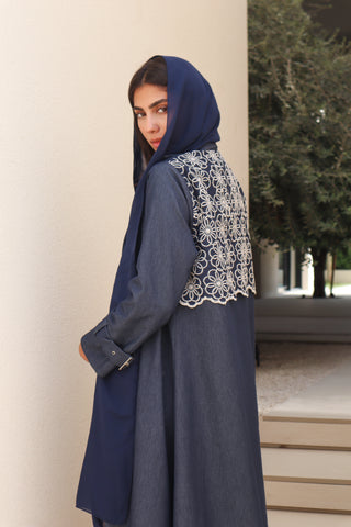 Shimmer-The Art of Layers S.LO2 - a luxurious denim abaya featuring beautifully embroidered floral panels that add depth and elegance to the design. 