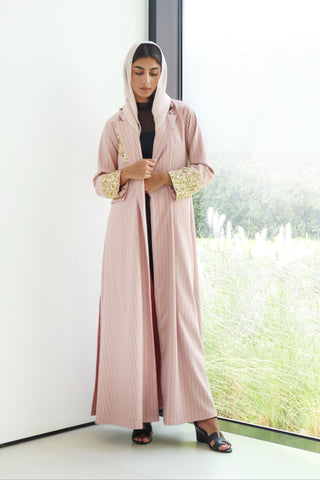 shimmer-The Art Of Layers S.LO5 - an elegant pink pinstripe abaya adorned with delicate gold sequin detailing for a refined touch of glamour.