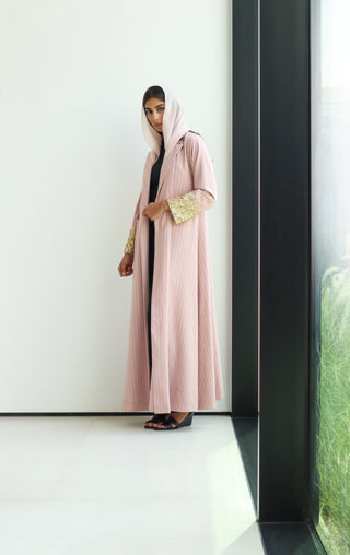 shimmer-The Art Of Layers S.LO5 - an elegant pink pinstripe abaya adorned with delicate gold sequin detailing for a refined touch of glamour.