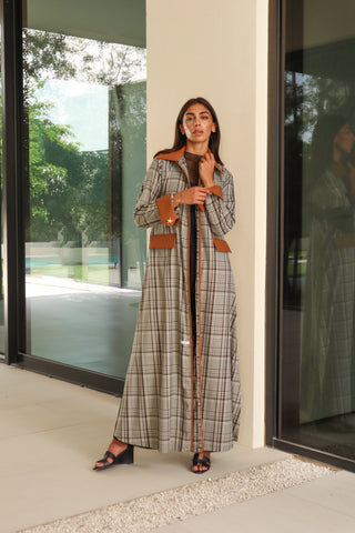 Shimmer - The Art of Layers S.LO8 - a refined check abaya featuring a rich brown leather collar, cuffs, and pocket details for a sophisticated finish. 