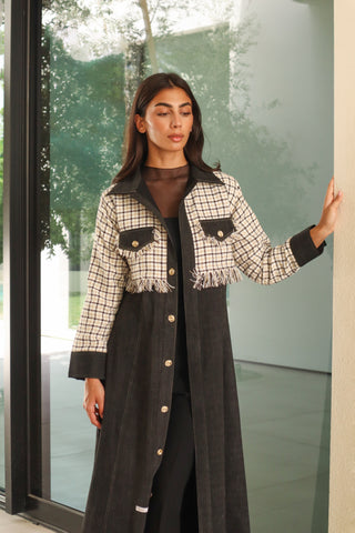 The Art of Layers S.LO10 - striking black abaya featuring elegant check tweed detailing, delicate fringe accents, and refined gold buttons. 